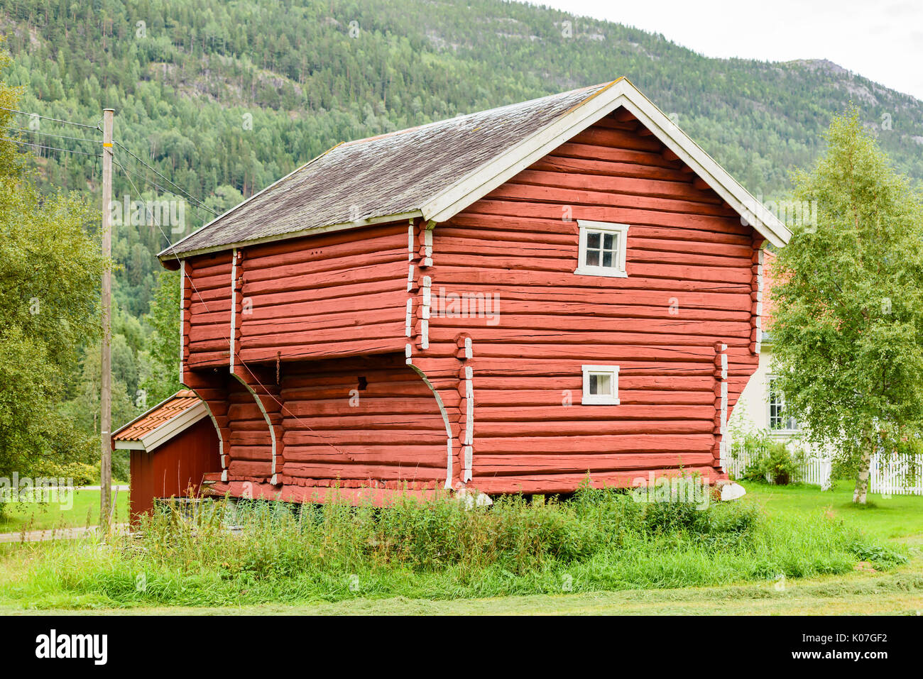 Old red wooden loft house or loft shed. Location Norway. Stock Photo