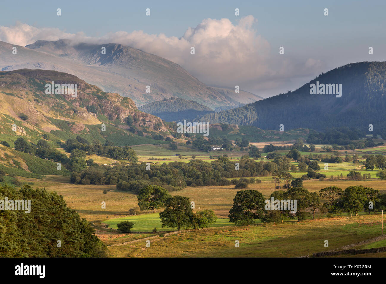 Looking SE from Castle Rigg stone circle, with the valley of the Naddle Beck in the foreground, High Rigg, and Helvellyn - shrouded in clouds - beyond Stock Photo