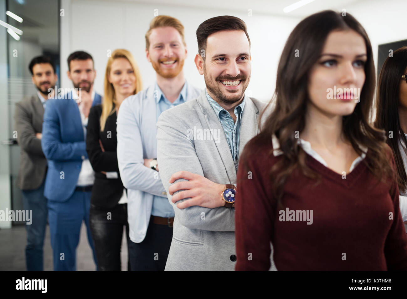 Team of cheerful businesspeople posing for group picture Stock Photo ...