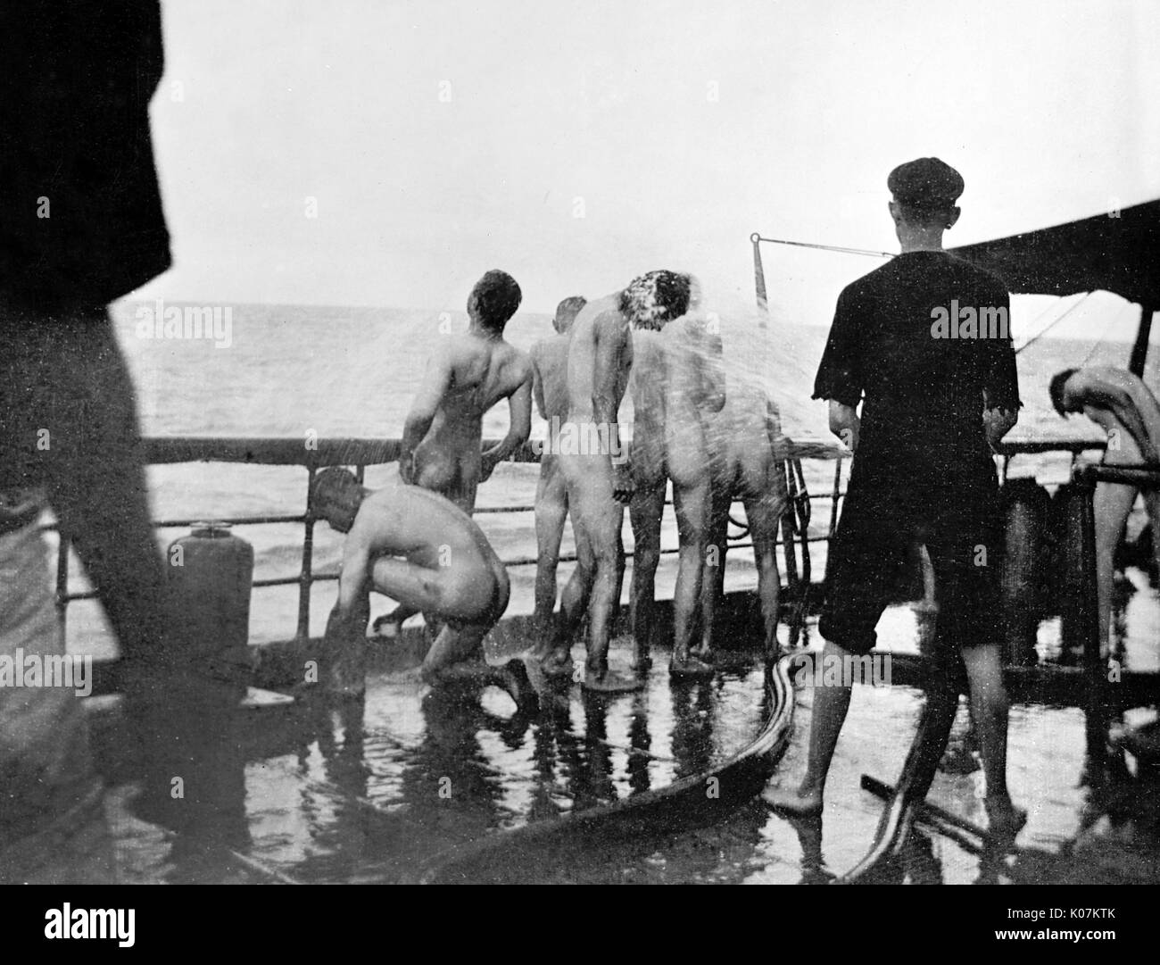 Sailors on the U.S.S. Yankee take a morning bath Stock Photo