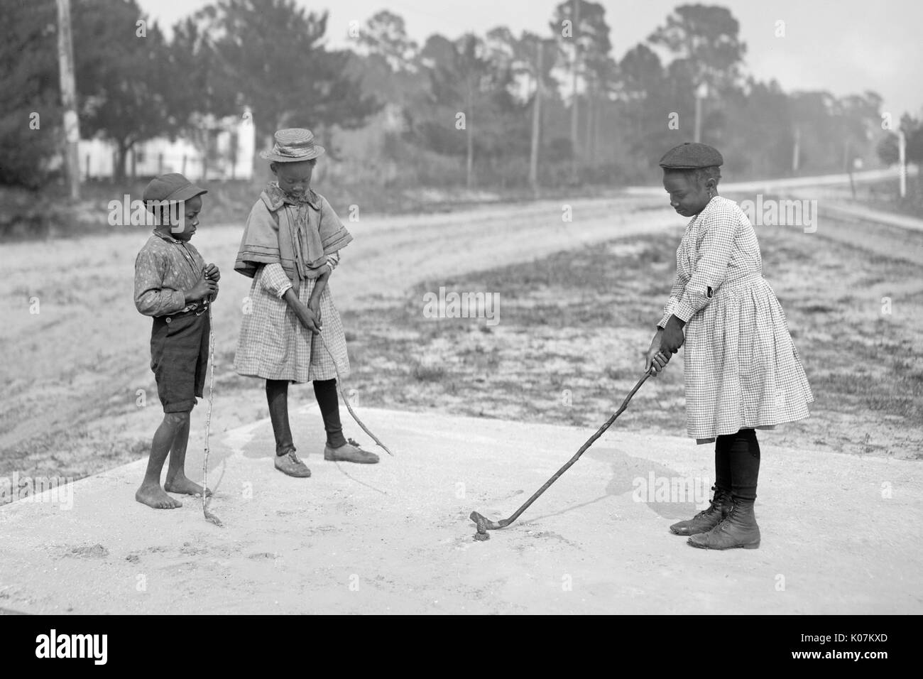 African-American children playing golf in America Stock Photo