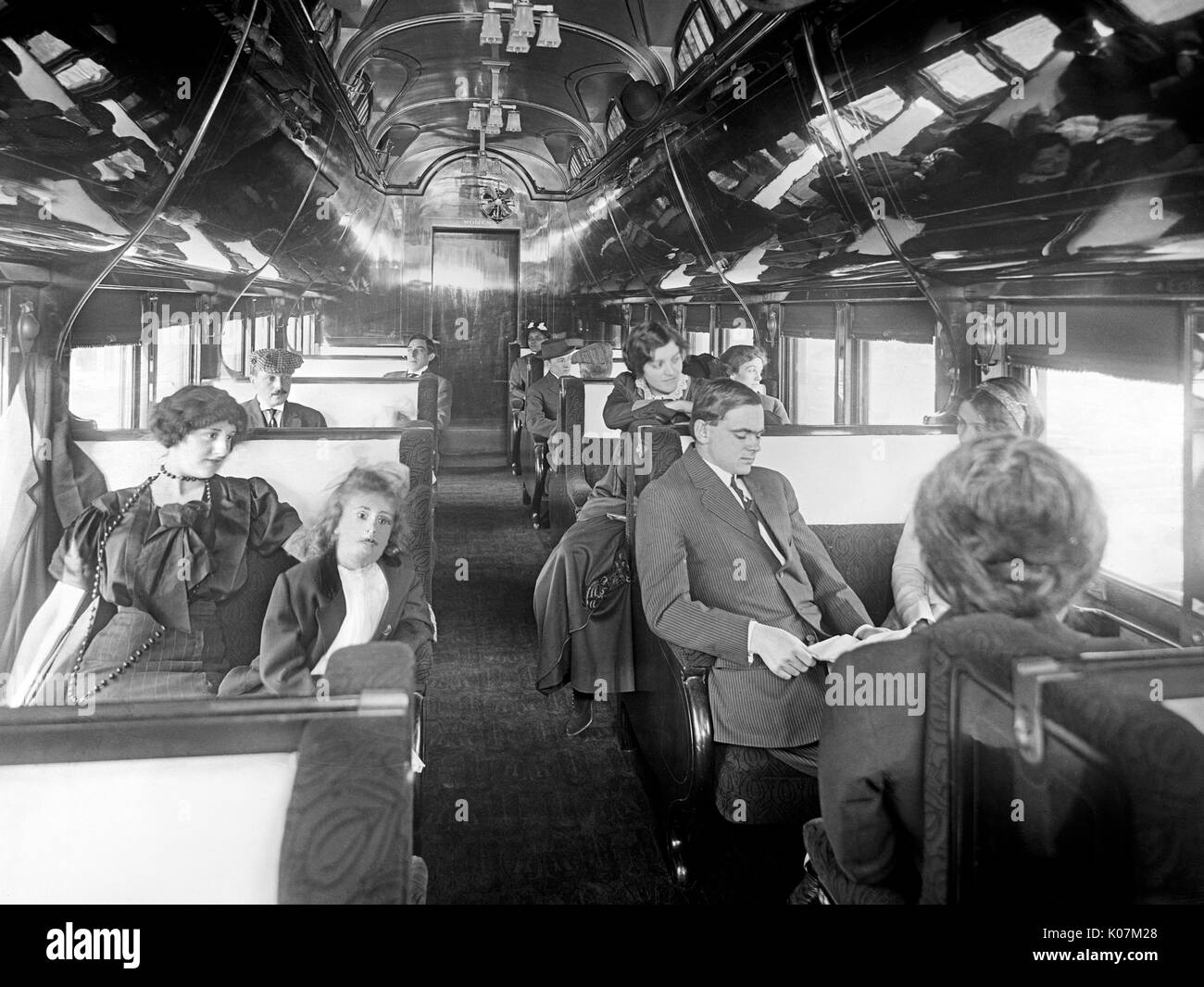 Passengers in a standard Pullman car on a deluxe overland limited train in America     Date: circa 1910 Stock Photo