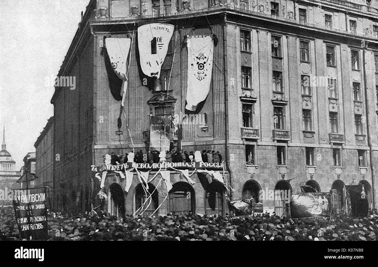 The Hotel Astoria showing its loyalty to the Revolution with banners, Petrograd (St Petersburg), Russia. The ground floor windows are still boarded up, following the earlier attack on the building.      Date: circa 1918 Stock Photo