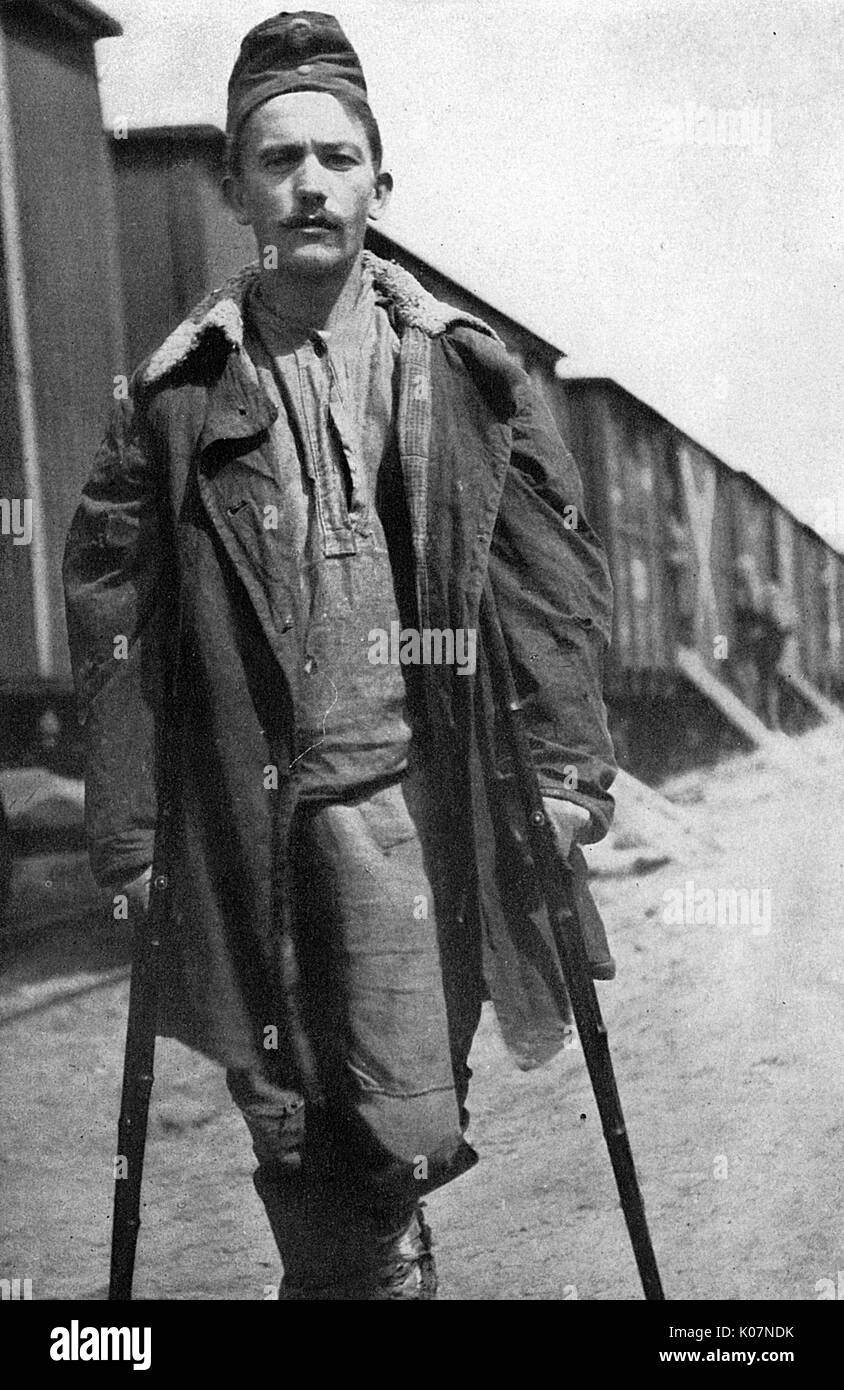 Wounded Austrian prisoner on crutches, Russia, WW1 Stock Photo