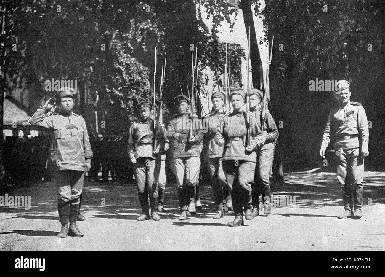 Maria Bochkareva (far left, 1889-1920), female Russian soldier who formed the Women's Battalion of Death and fought in the First World War. She is saluting during a review of women soldiers before their commanding officer.     Date: 1917 Stock Photo