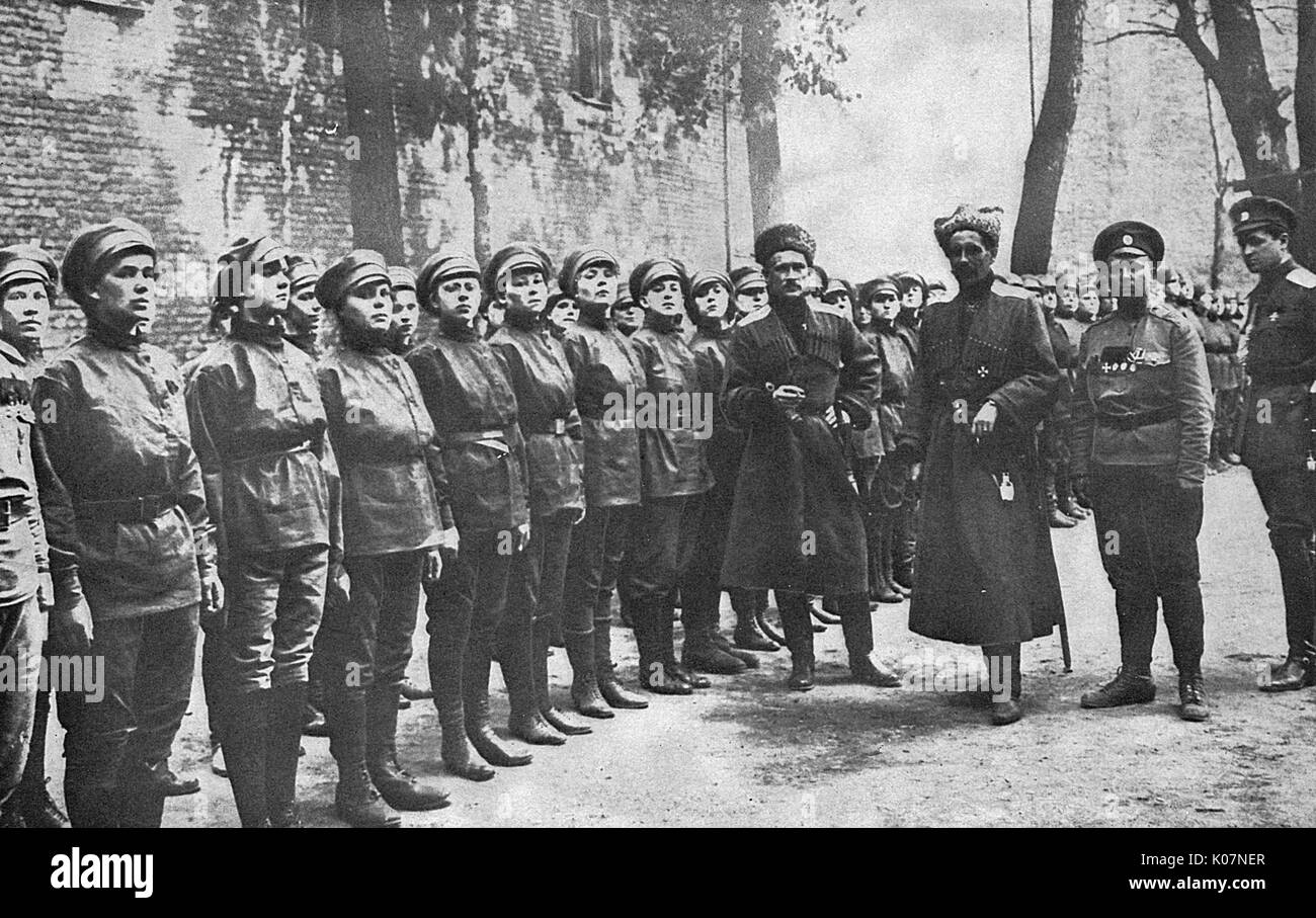 Maria Bochkareva (far right, 1889-1920), female Russian soldier who formed the Women's Battalion of Death and fought in the First World War. She is with visiting male officers who have come to encourage the women soldiers.      Date: 1917 Stock Photo