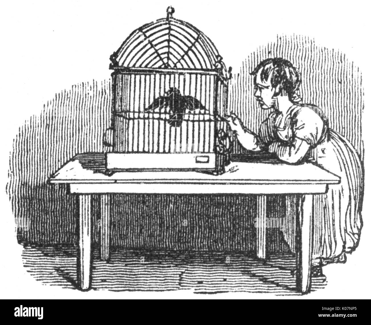 Girl with caged bird, c. 1800 Stock Photo