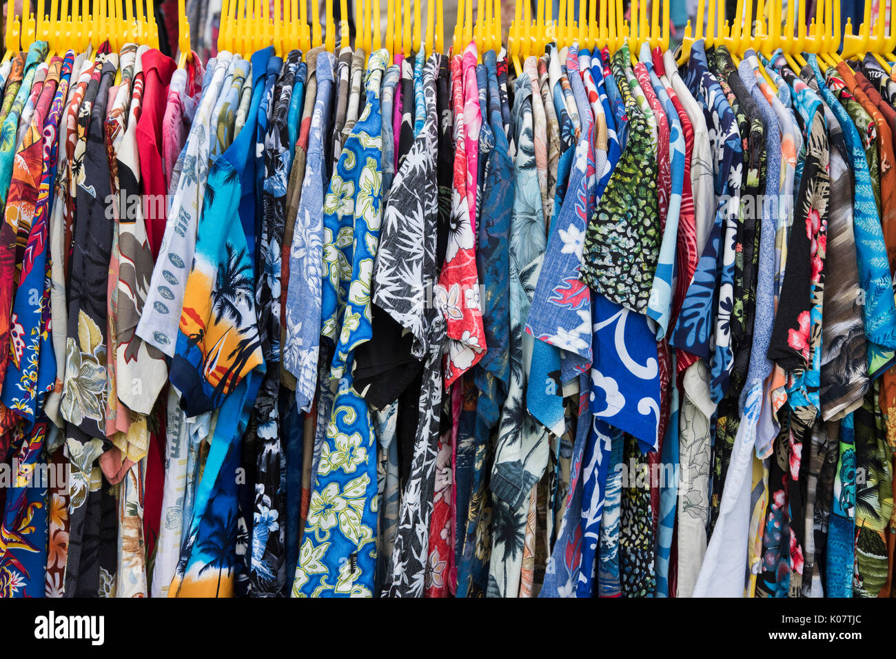 Vintage Style hawaiian shirts on a clothes rail at a vintage retro festival. UK Stock Photo