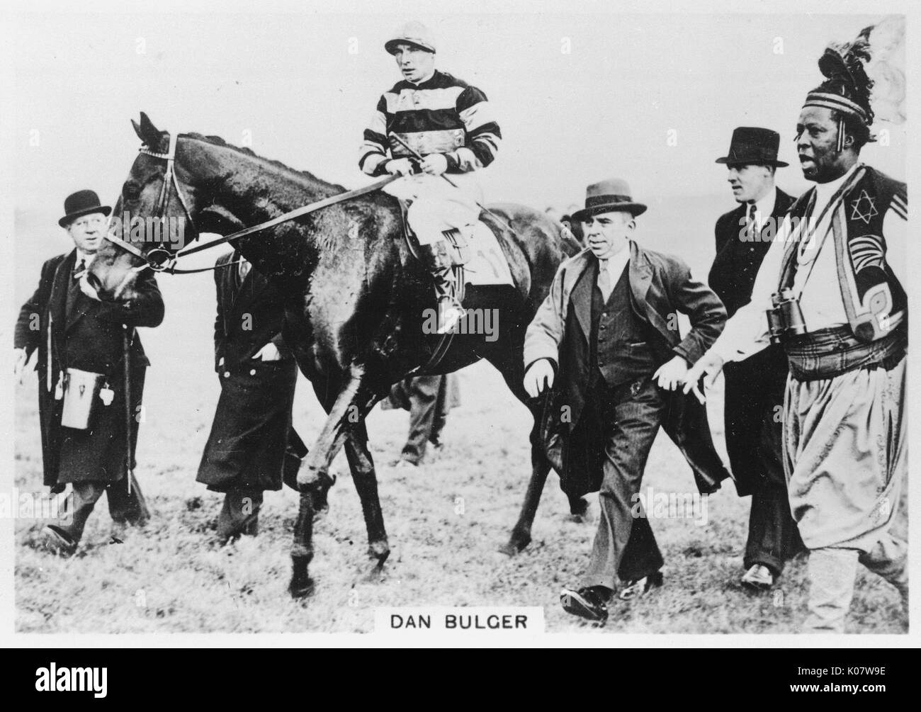 Racehorse Dan Bulger with jockey on horseback, and Prince Monolulu, horseracing tipster, at the races.   circa 1936 Stock Photo