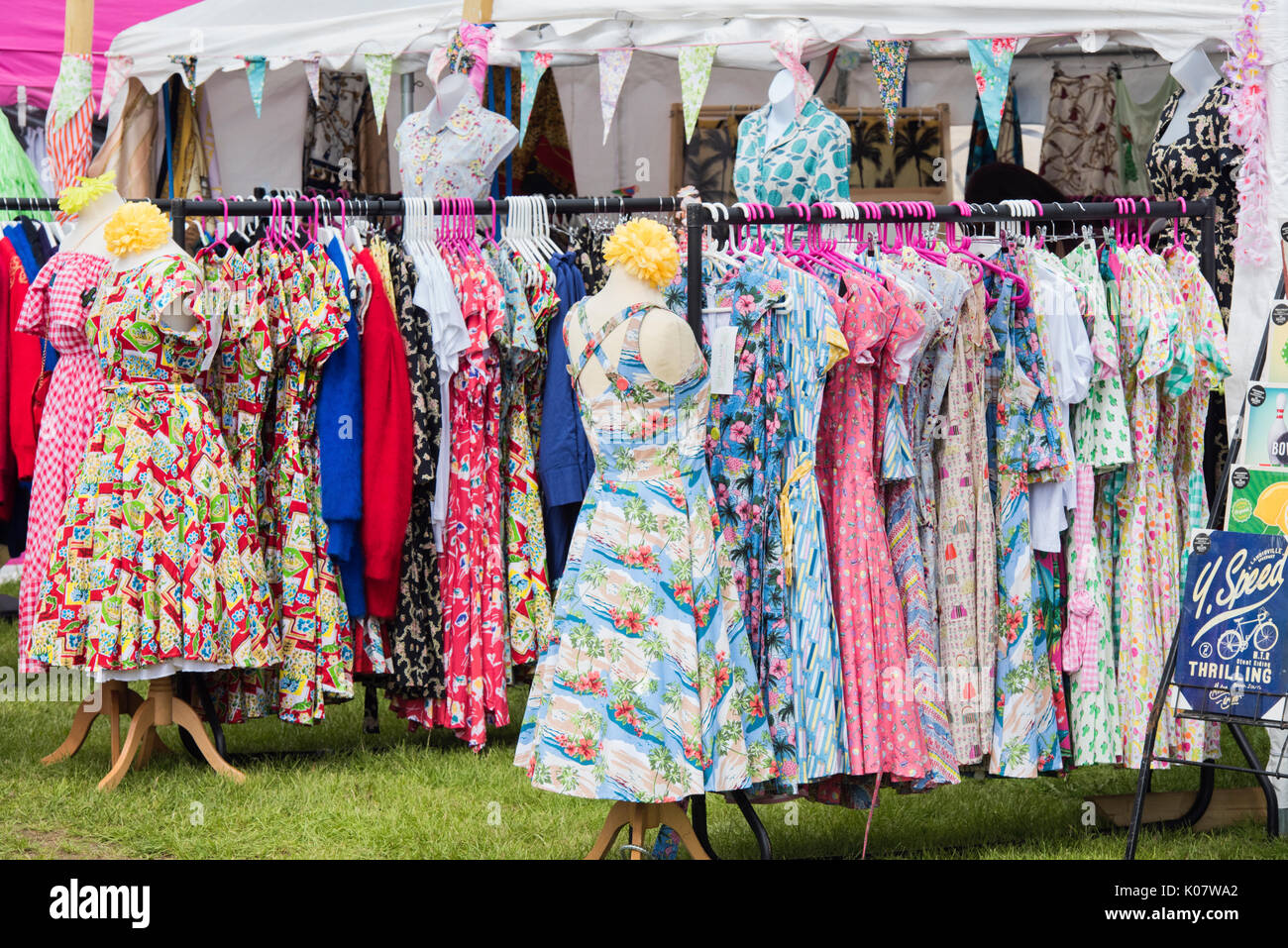 Vintage Style Dresses on a clothes rail at a vintage retro festival. UK Stock Photo