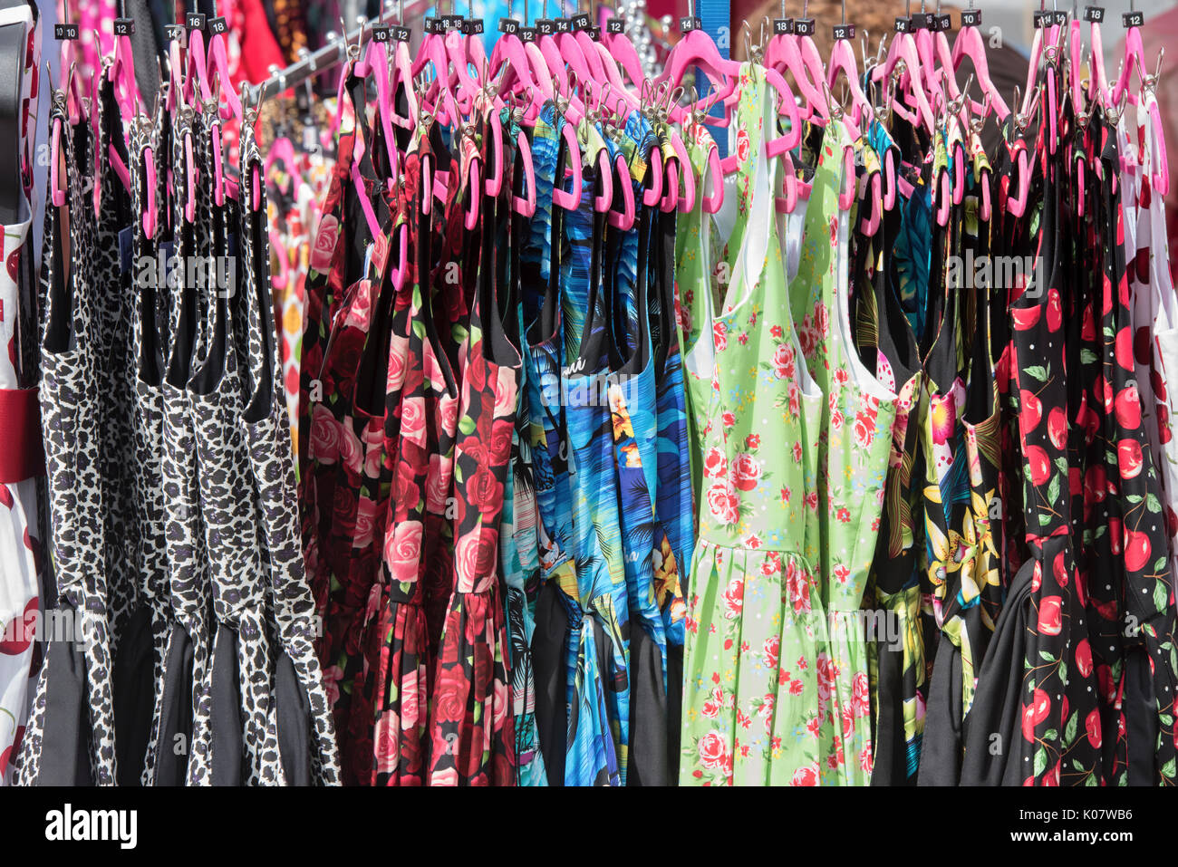 Vintage Style Dresses on a clothes rail at a vintage retro festival. UK Stock Photo