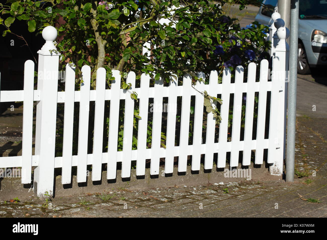 White Wooden Garden Fence With Plants Stock Photo Alamy