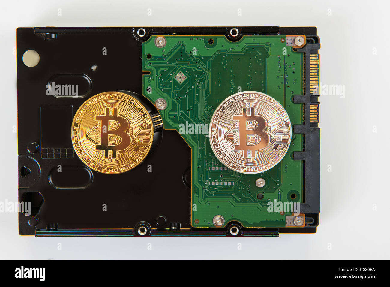 Bitcoin coin with HDD Stock Photo - Alamy