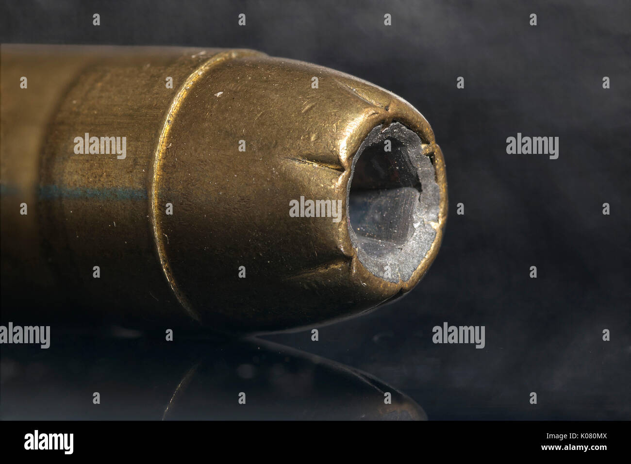45 caliber gun round ammunition, closeup macro, focus stacked, on a black background, showing lots of detail and copy space. Stock Photo