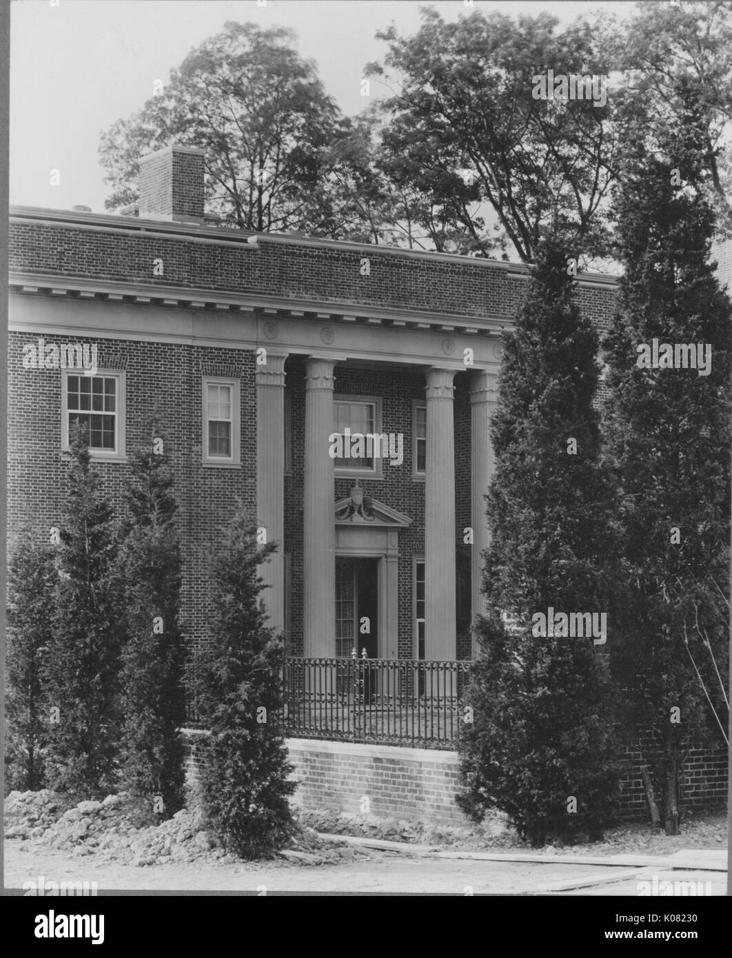 Photograph of a twostory Roland Park home in Baltimore, with Doric