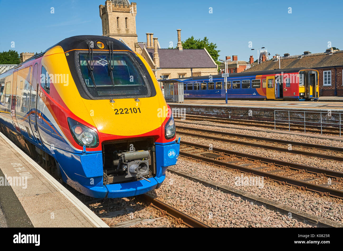 The front streamlined end of a class 222 passenger train, in striking East Midlands Trains colours Stock Photo