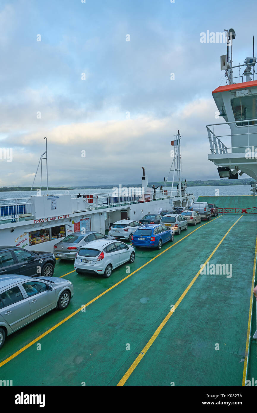 Cars on the ferry across the River Shannon running between County Clare