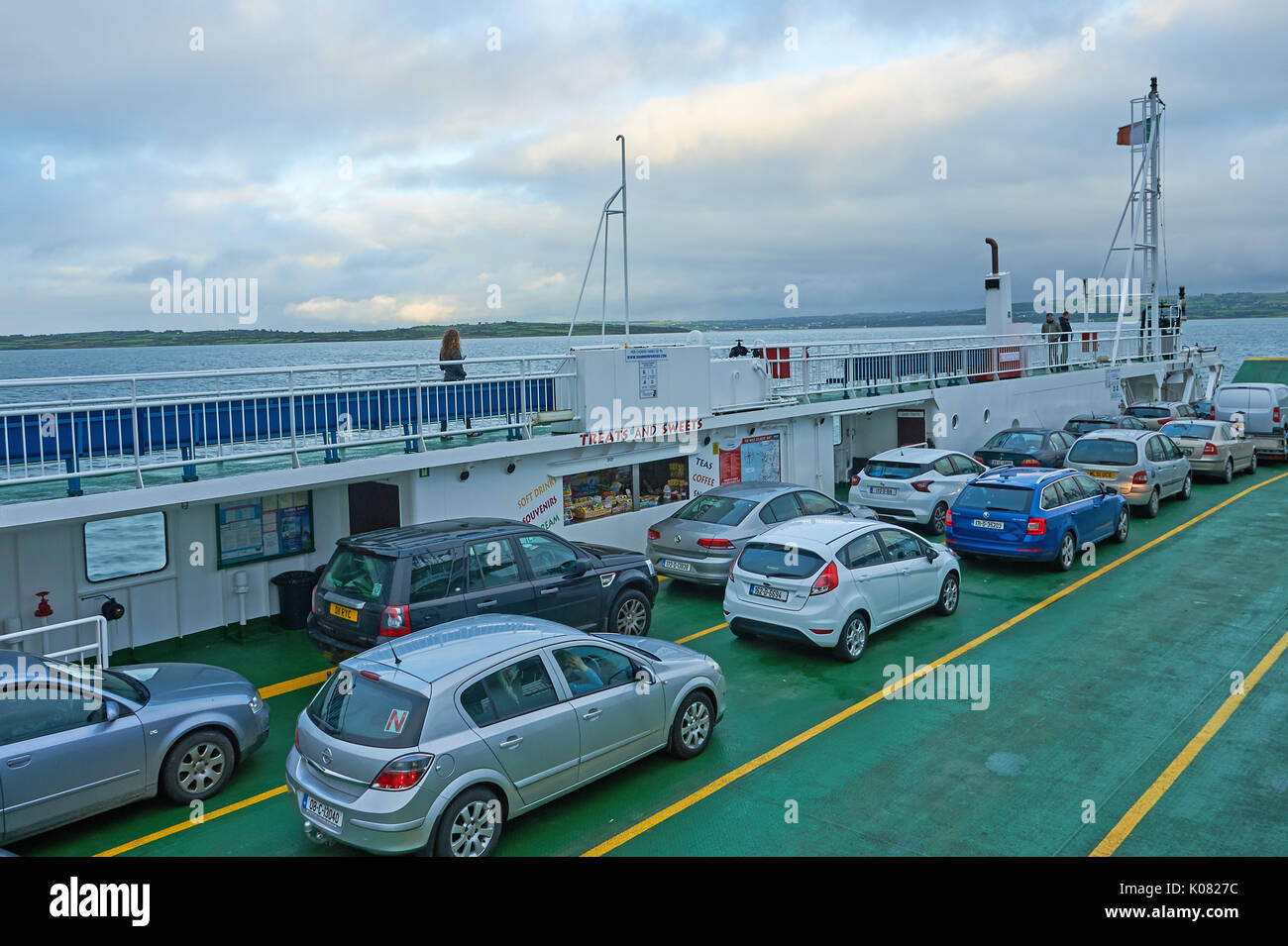 Cars on the ferry across the River Shannon running between County Clare