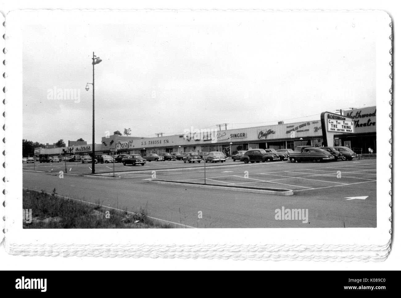 Photograph of the parking lot for the Northwood Shopping Center in