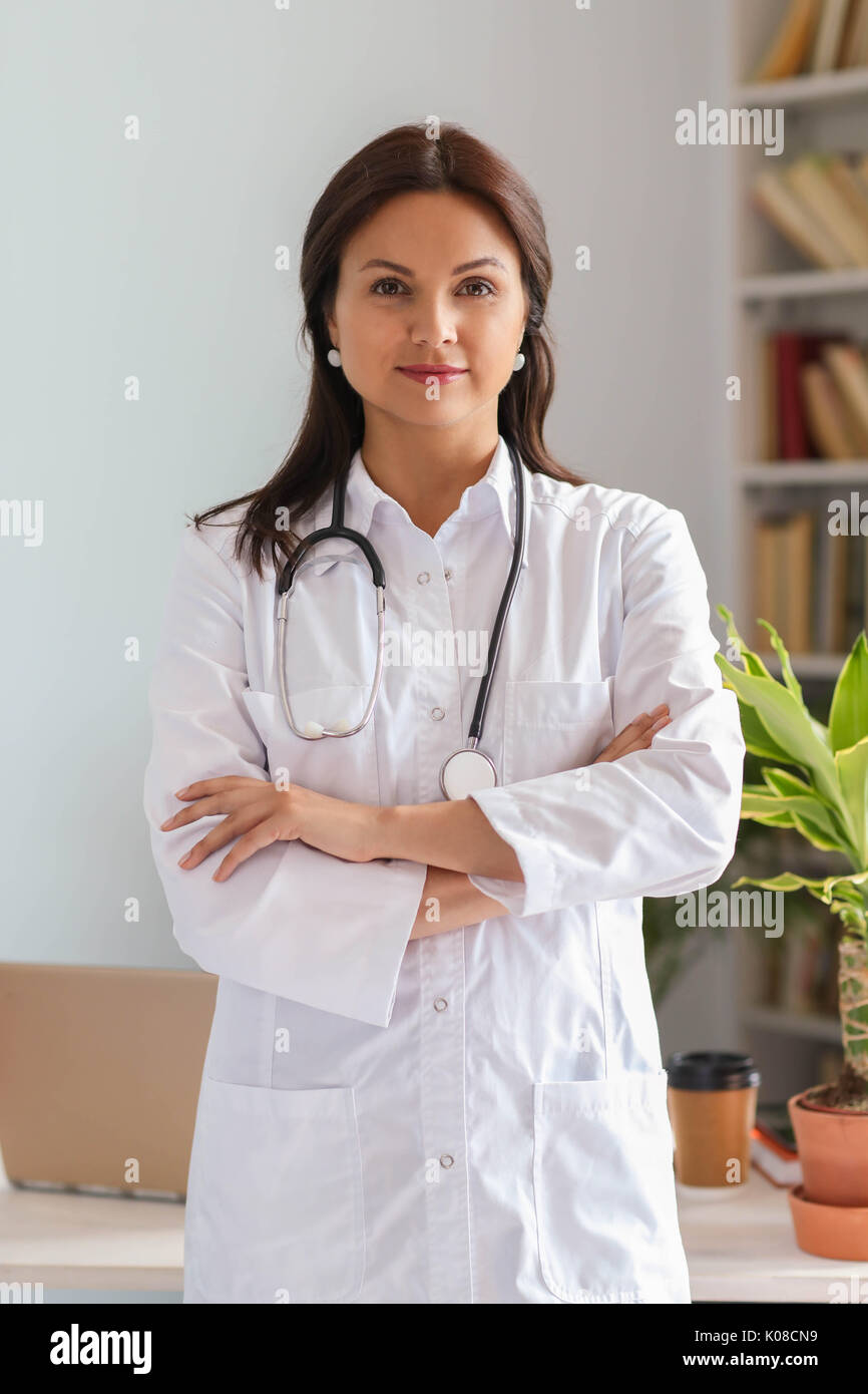Happy friendly woman doctor hi-res stock photography and images - Alamy