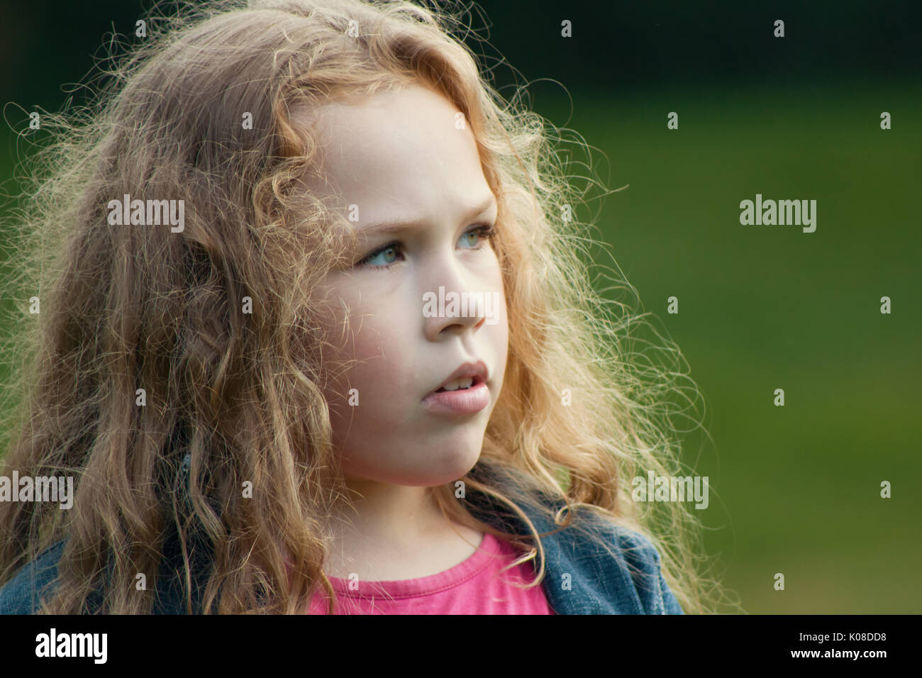 Sweet little girl outdoors - pretty smiling child Stock Photo - Alamy