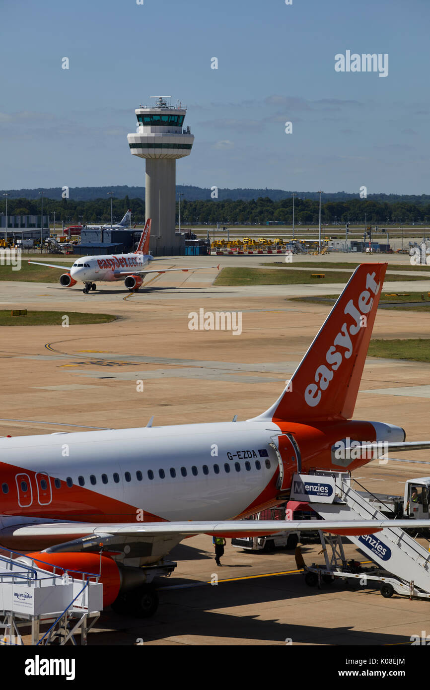 Air traffic control tower and lowcost carrier EasyJet at Gatwick