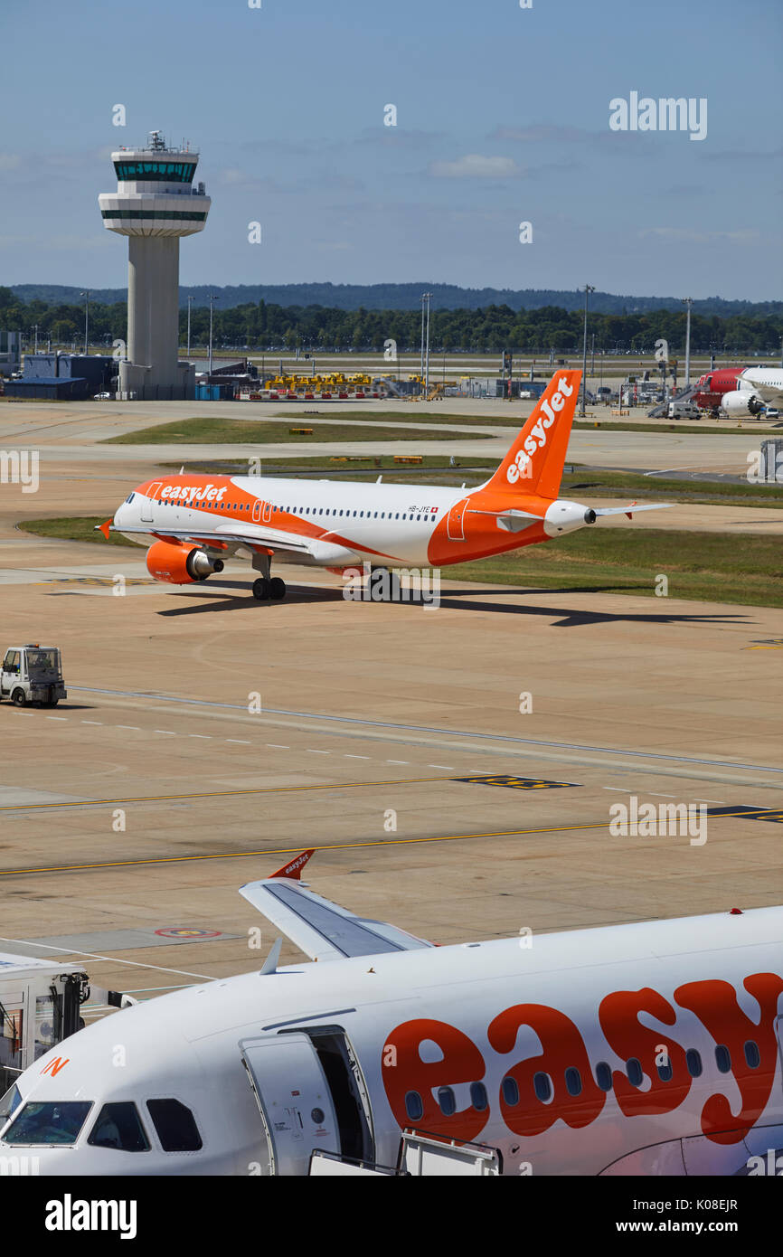 Air traffic control tower and lowcost carrier EasyJet at Gatwick
