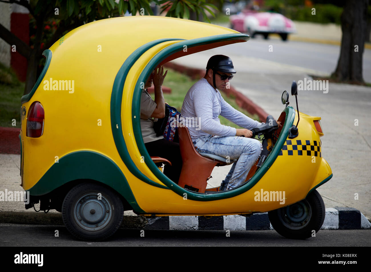 Cuban Coco taxi bike at Varadero, Cuba, a Caribbean island nation under communist rule Stock Photo