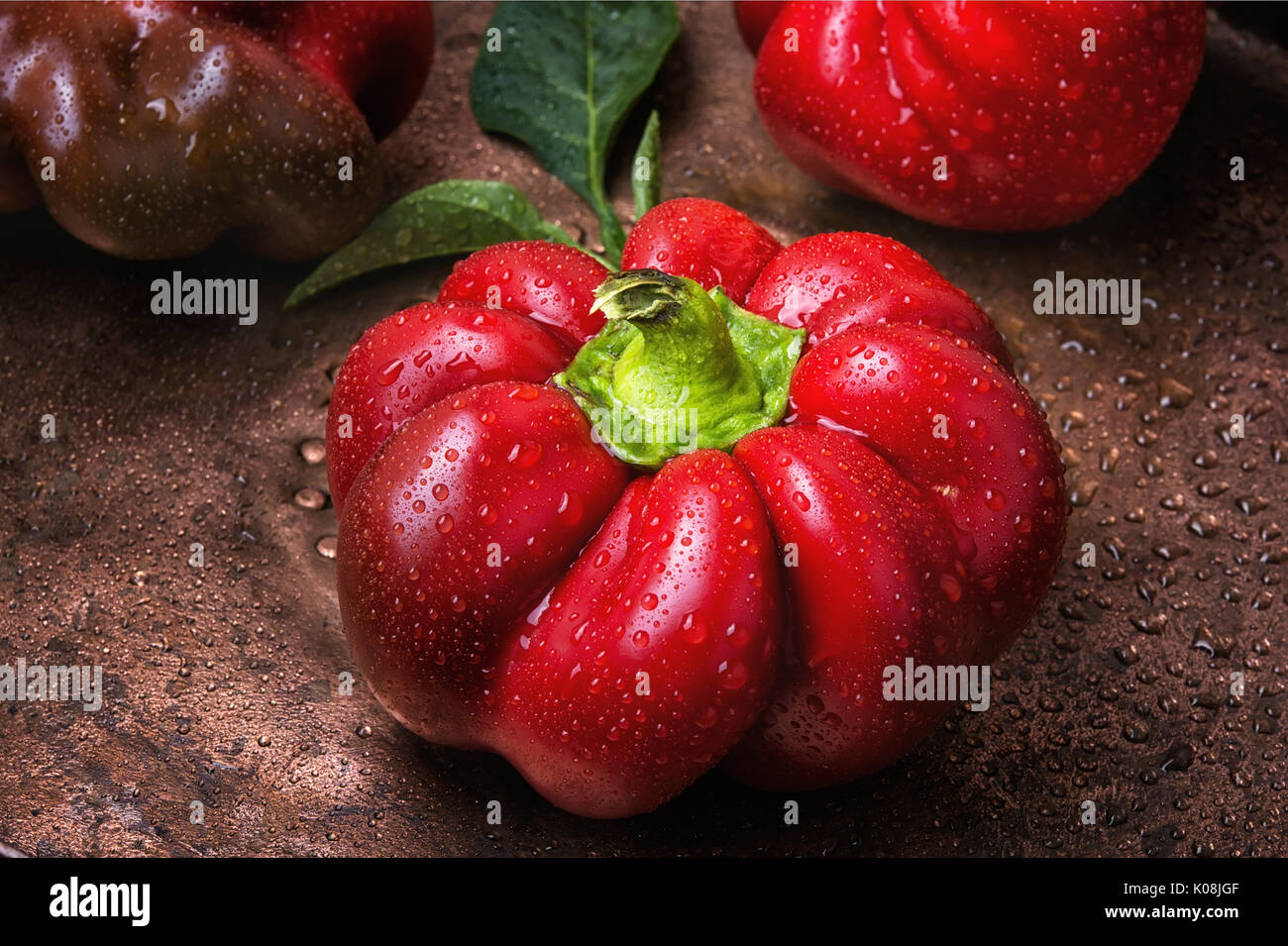 Red sweet bell pepper on metal background Stock Photo - Alamy