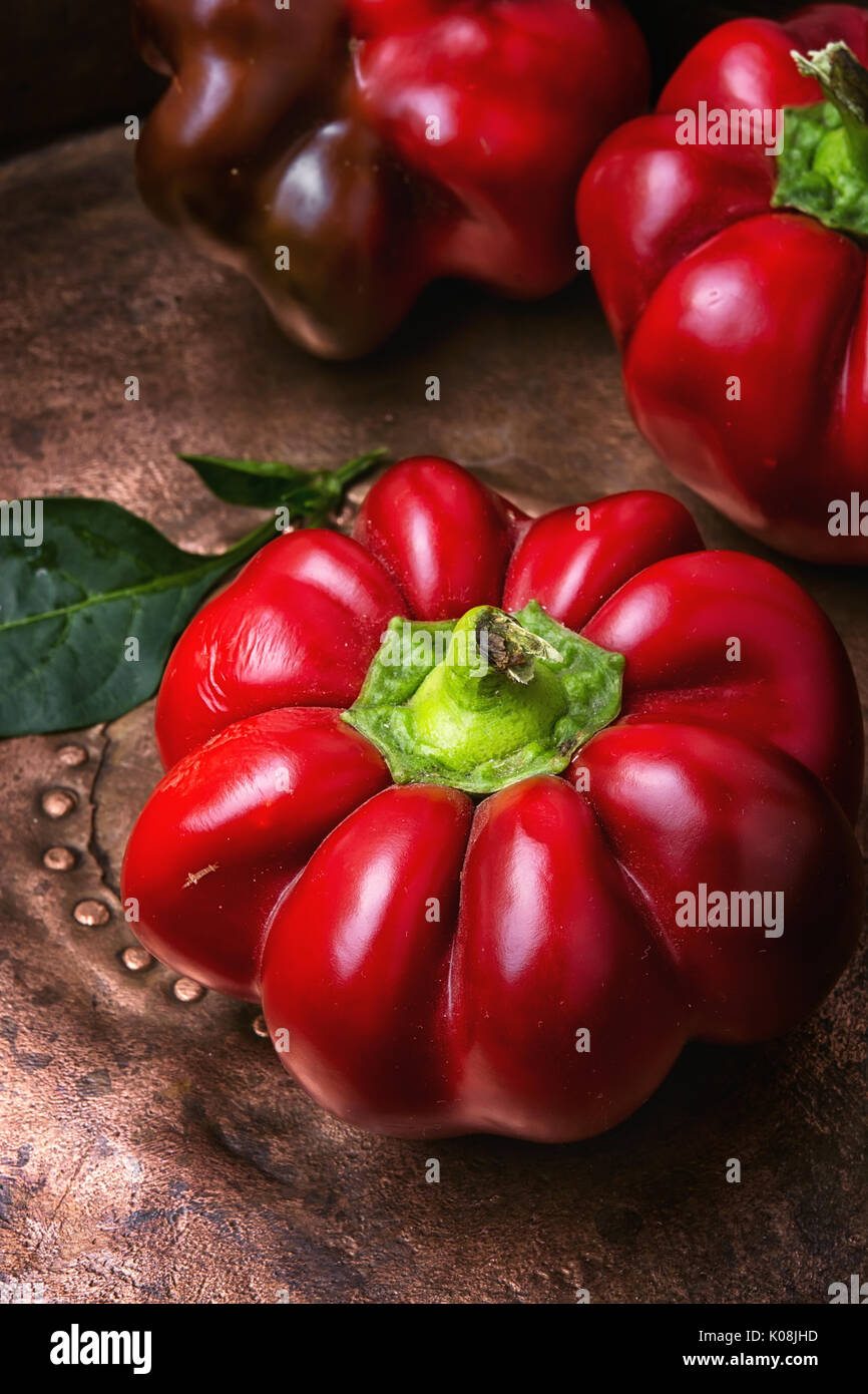 Red sweet bell pepper on metal background Stock Photo - Alamy