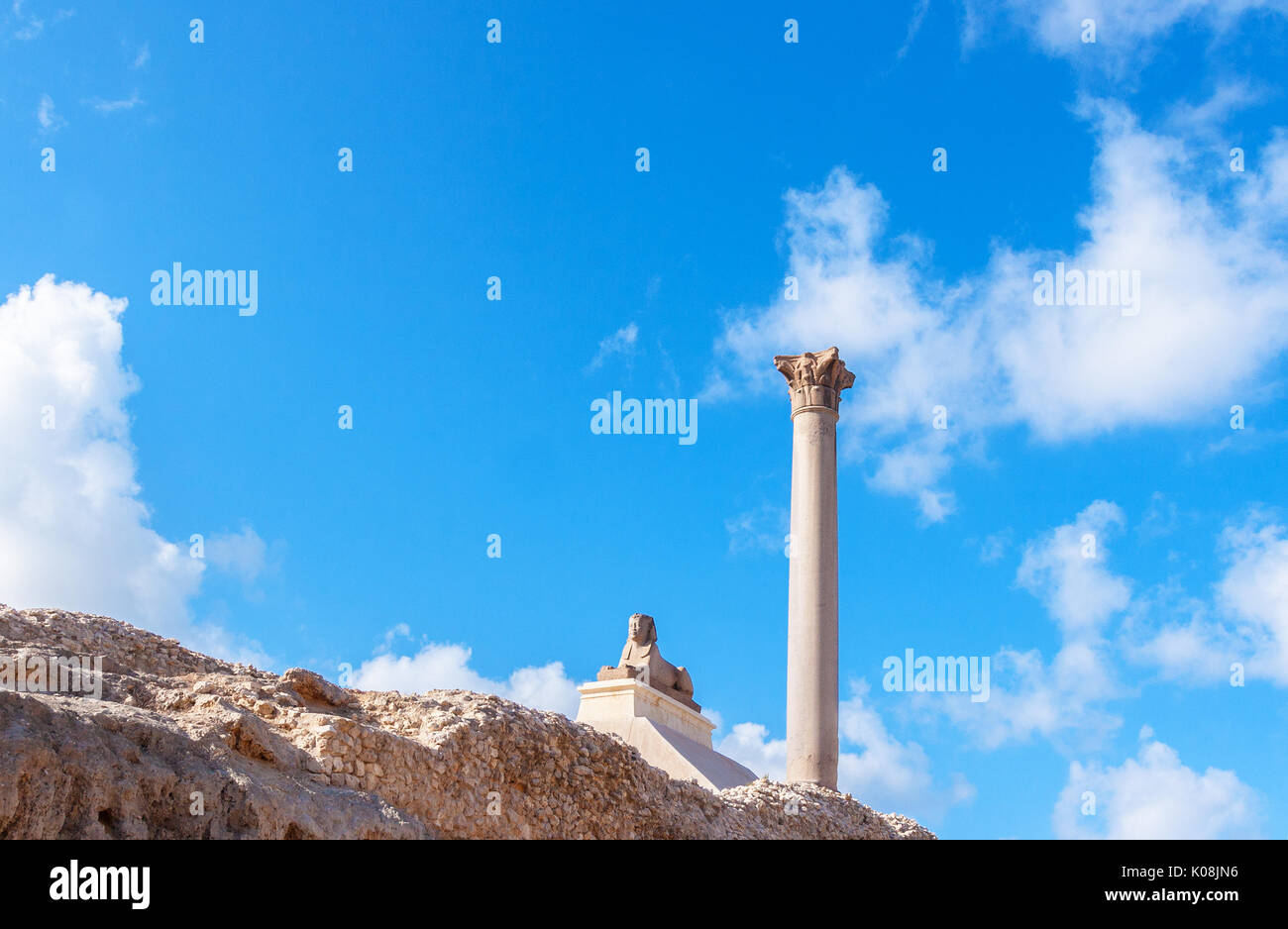 Pompey's pillar and ancient sphinx statue roman triumphal column in ...
