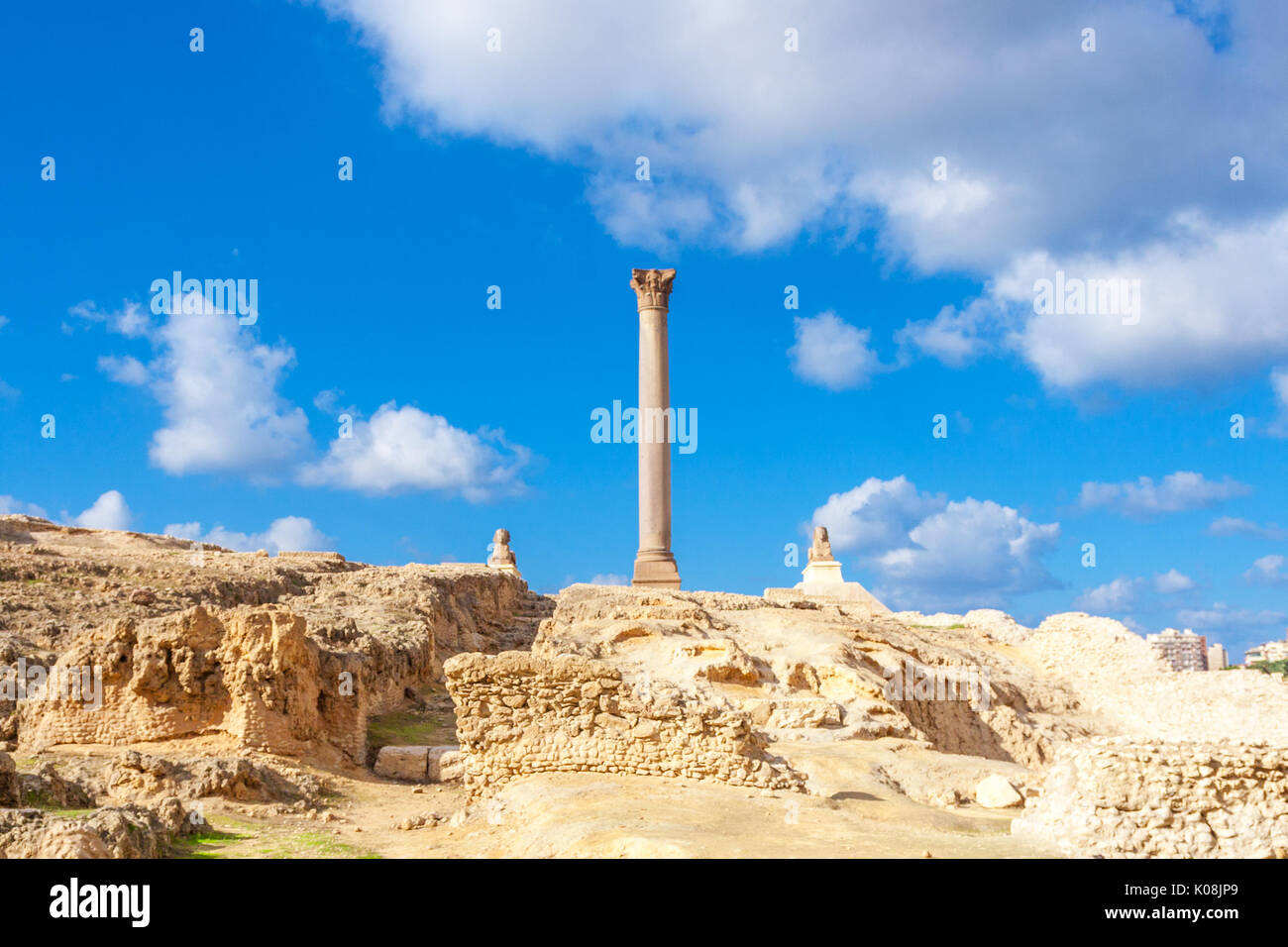 Pompey's pillar and ancient sphinx statue roman triumphal column in Alexandria, Egypt Stock Photo
