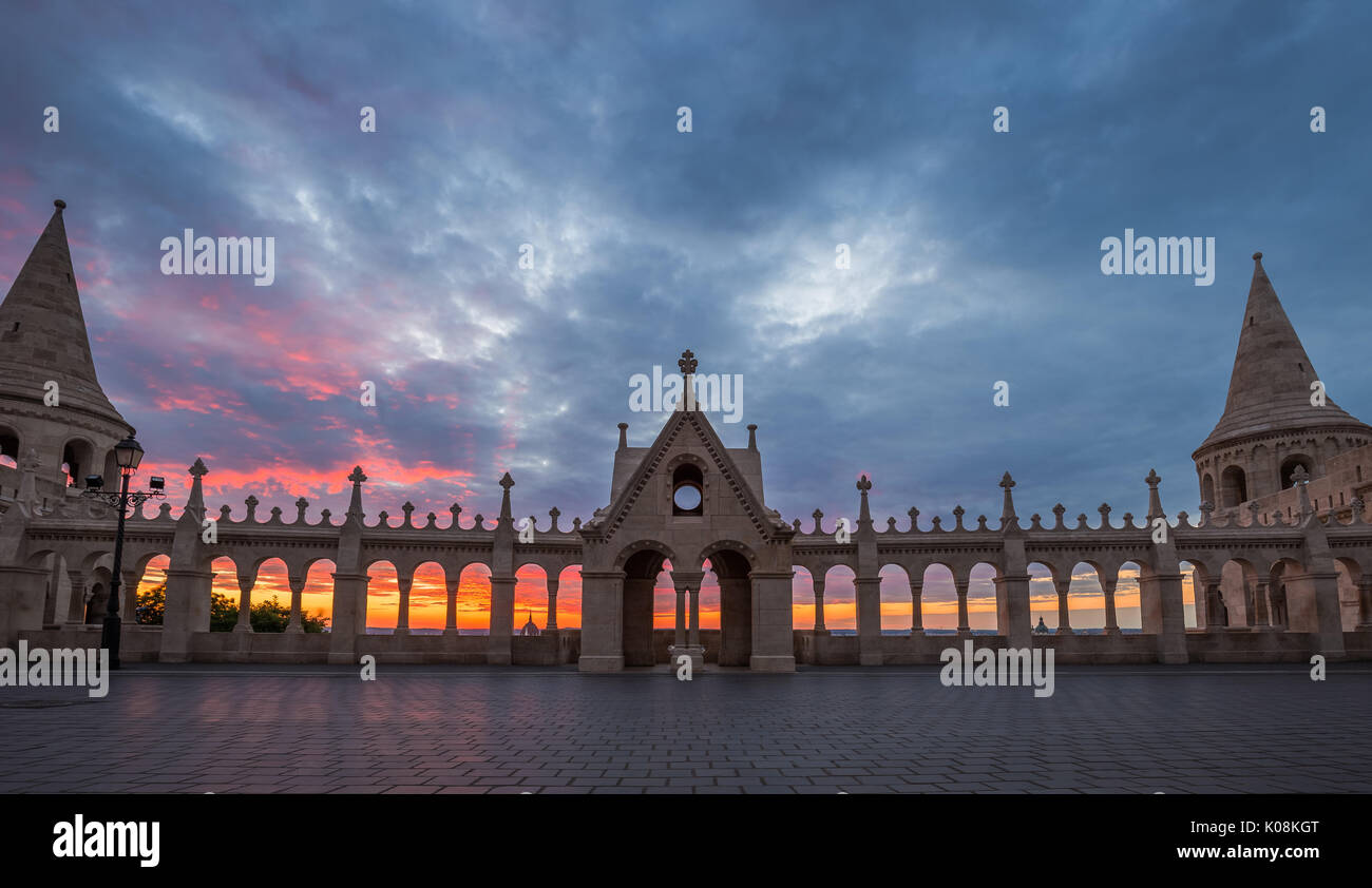 Budapest, Hungary - The Parliament of Hungary and city of Budapest throught the Fisherman's Bastion's arch windows at sunrise with beautiful sky and c Stock Photo