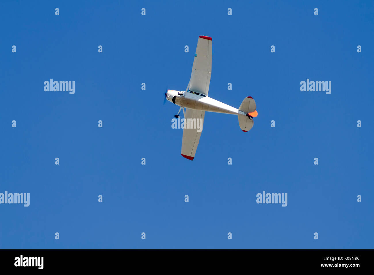 Single Engine Airplane against blue sky Stock Photo