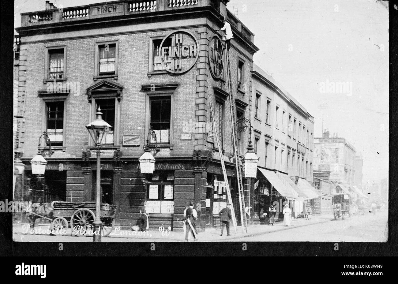 Portobello Road, West London, with a Finch's pub on the left. Date