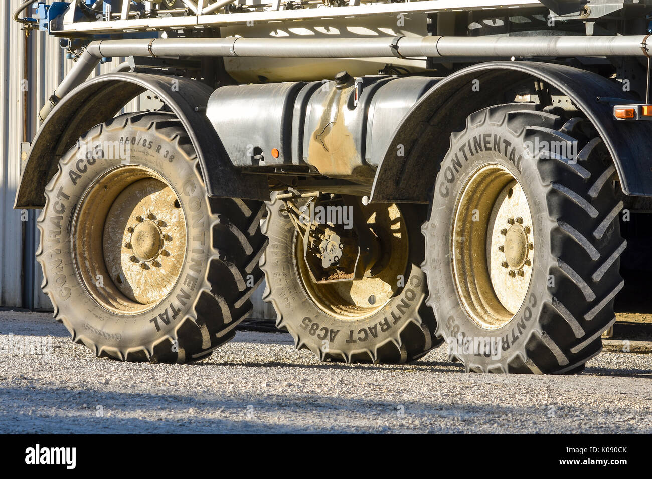 Ribbed heavy-duty 'Continental Contract' tyres on farm machine. Stock Photo