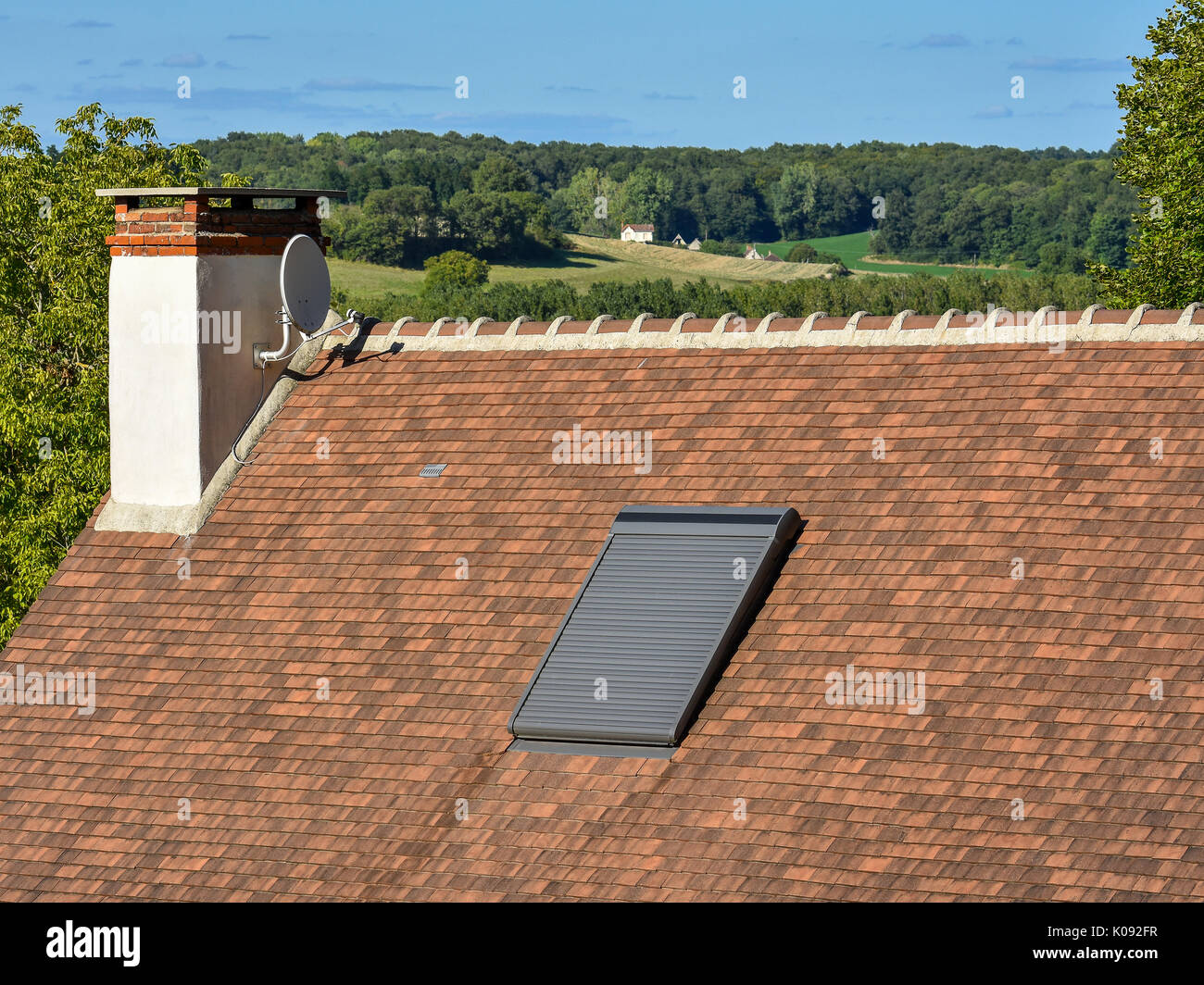 Velux roof-light window with blind closed. Stock Photo