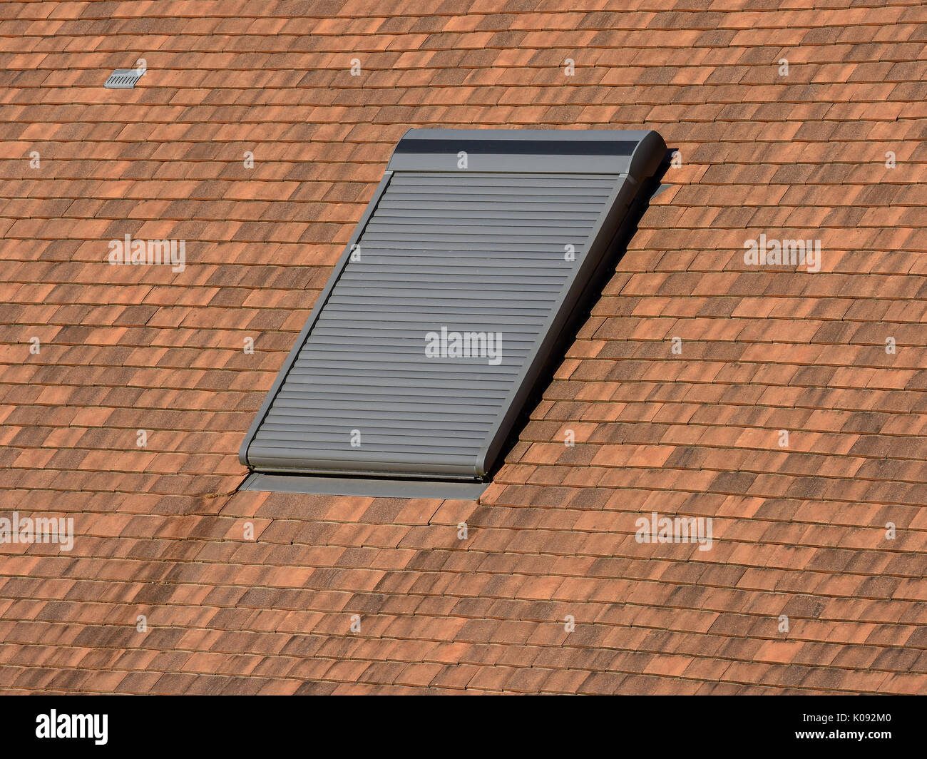 Velux roof-light window with blind closed. Stock Photo