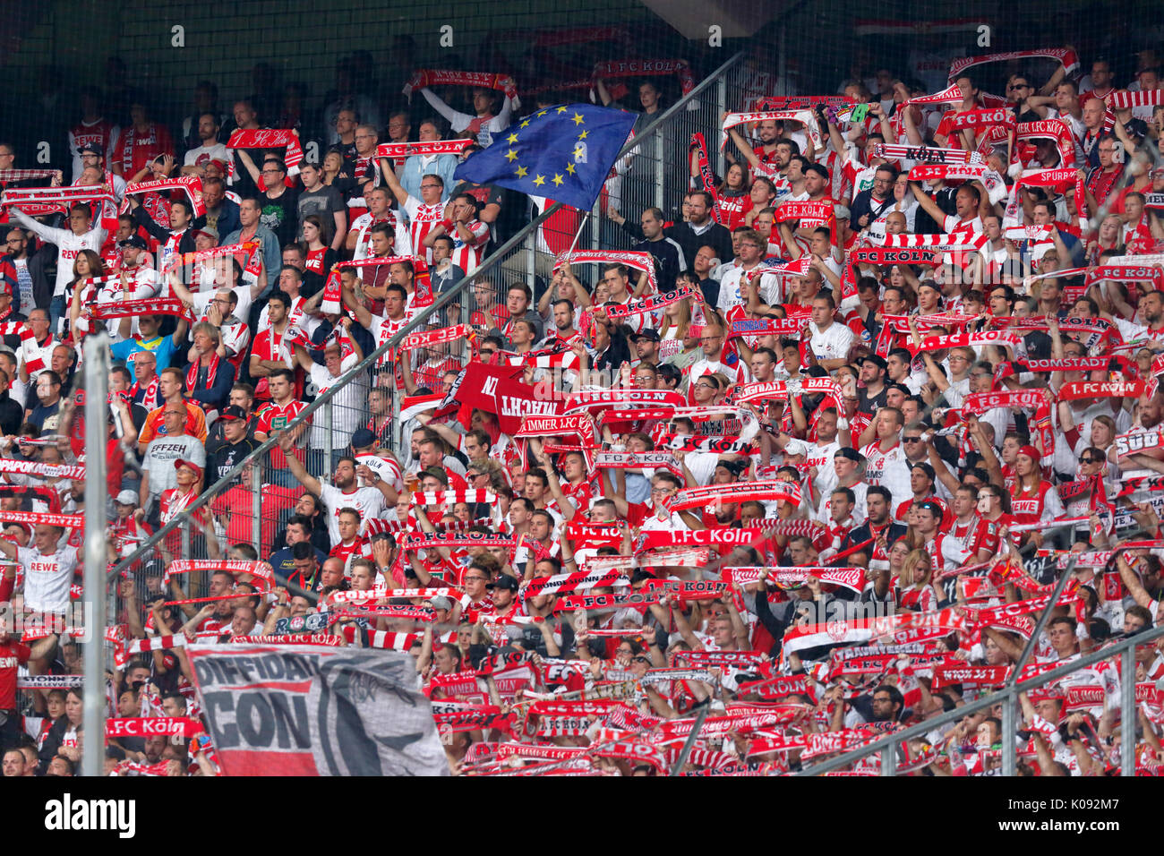 sports, football, Bundesliga, 2017/2018, Borussia Moenchengladbach vs 1. FC Koeln 1:0, Stadium Borussia Park, stadium view, stand, stands, visitors, spectators, Koeln football fans hold scarfs in club colours Stock Photo