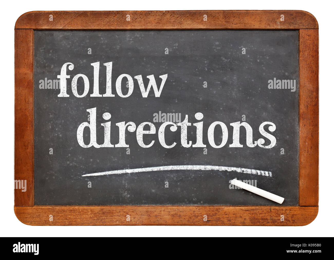Follow directions sign - white chalk text on a vintage slate blackboard Stock Photo