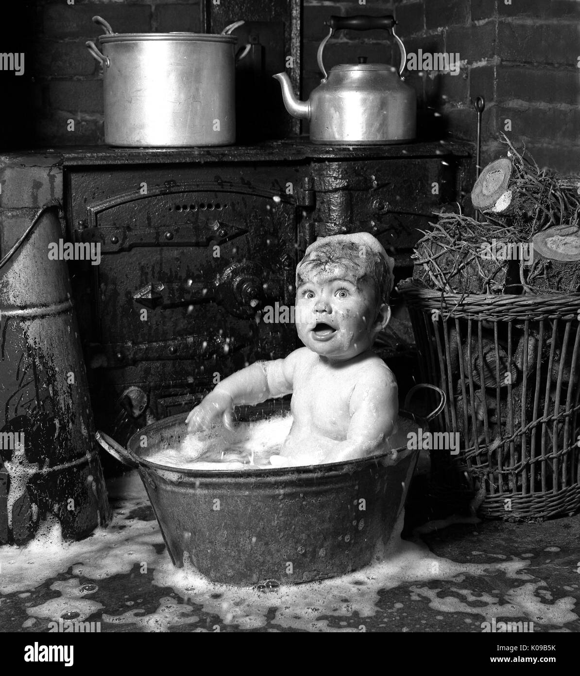 baby in tin bath in Cornish cottage Stock Photo