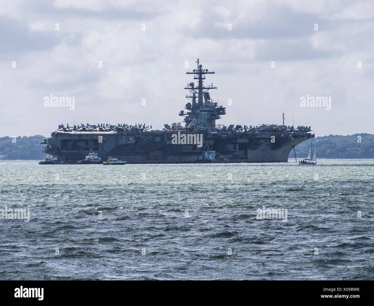 The USS George H W bush anchored in Stokes bay in the Solent, England Stock Photo