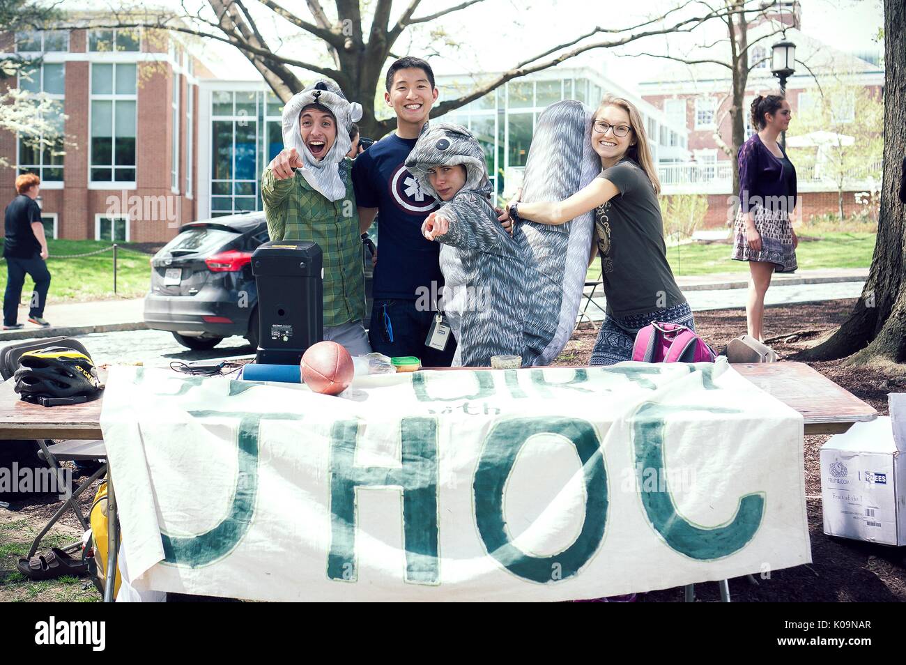 Members of the Johns Hopkins Outdoors Club (JHOC) stand behind their table at Spring Fair, a student-run Spring carnival, two of the members are dressed as squirrels, 2015. Courtesy Eric Chen. Stock Photo