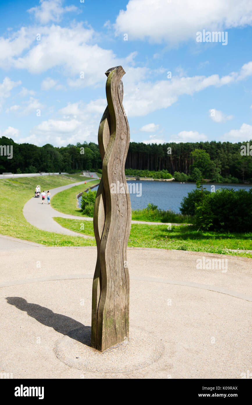 A carved wooden post close to Tilgate Lake, Tilgate Park, Crawley, West Sussex, England, UK Stock Photo