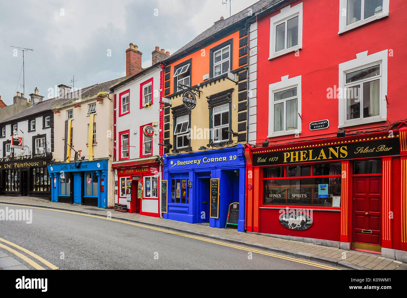 Historic pubs line a quiet street in Kilkenny, Ireland Stock Photo