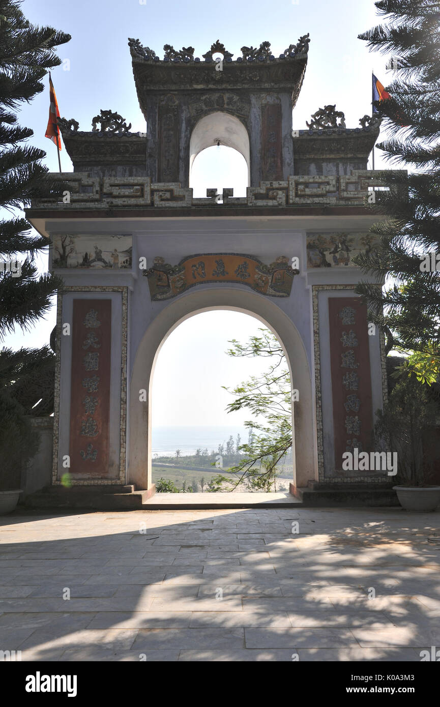 View of gate of pagoda and Da Nang in background. Linh Ung Non Nuoc Pagoda. Da Nang. VIETNAM Stock Photo