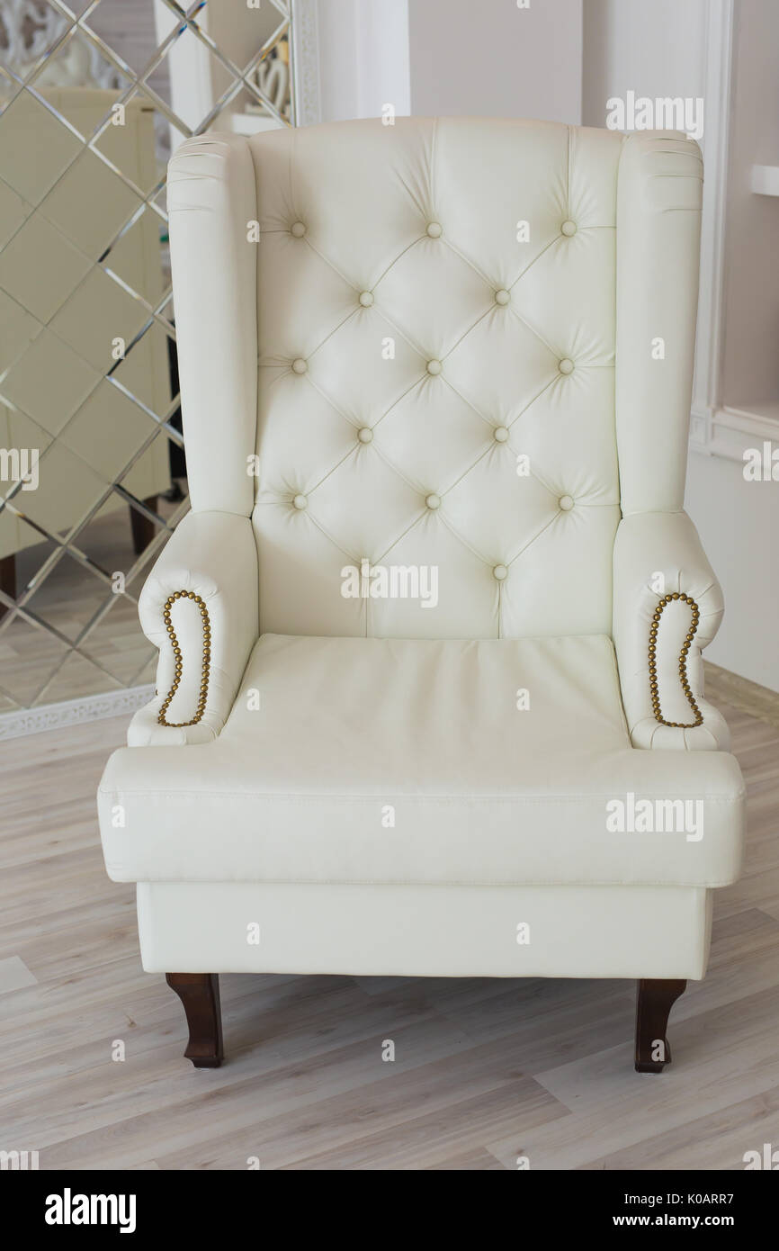 luxury armchair in a plain white interior Stock Photo - Alamy