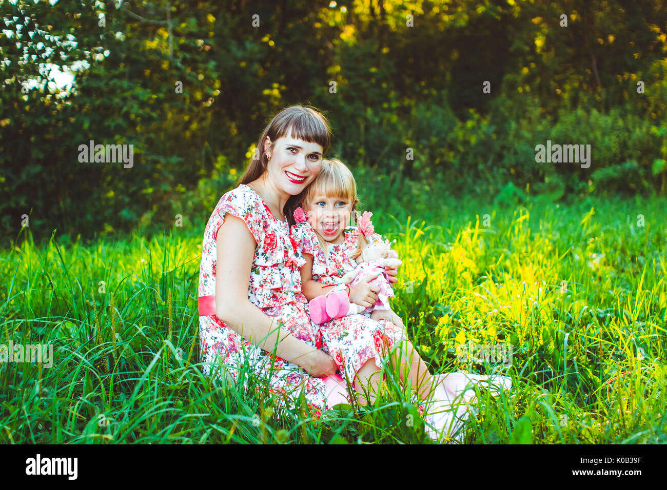 little girl on nature with the mother Stock Photo