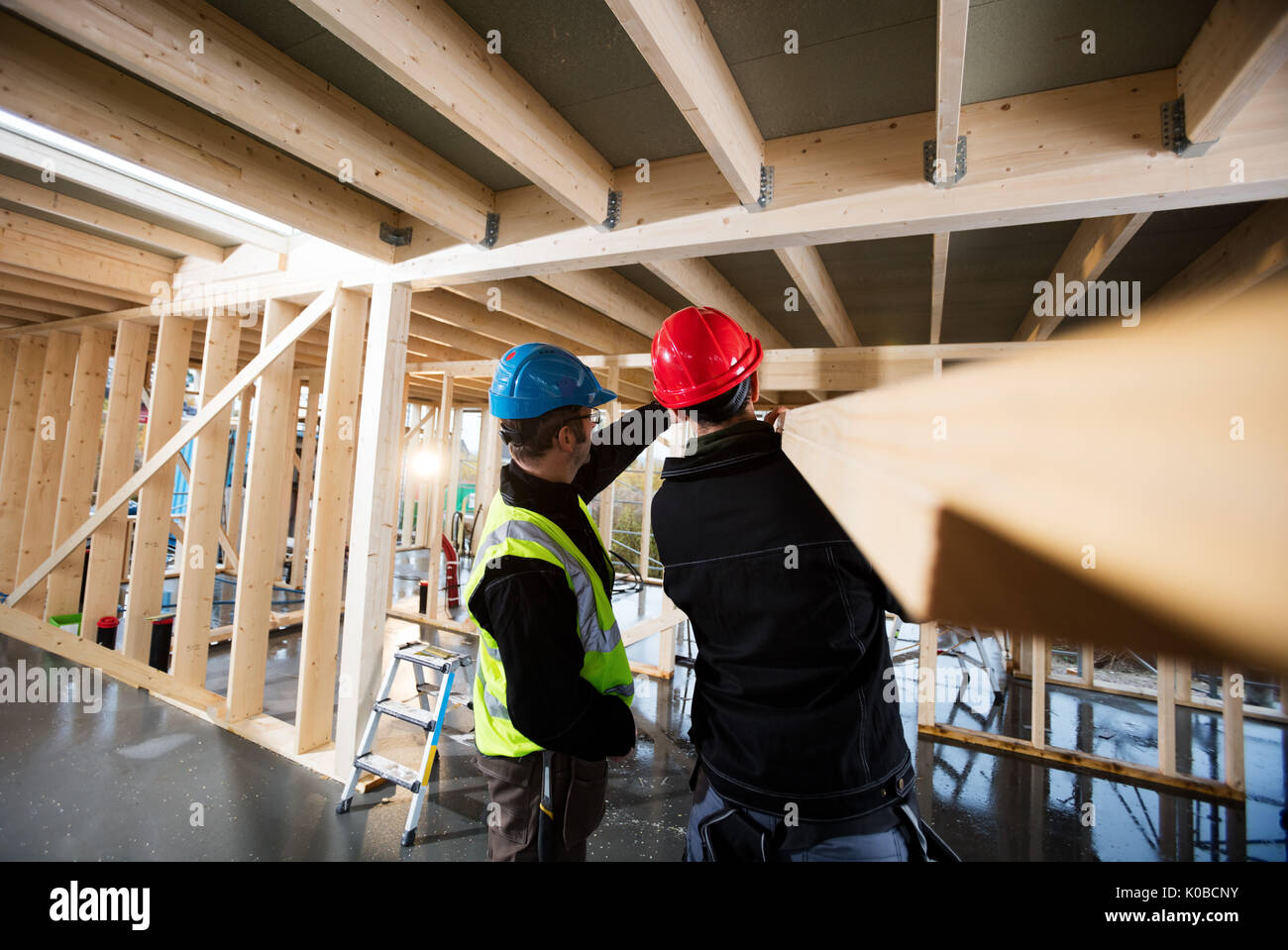 Carpenters Working At Construction Site Stock Photo