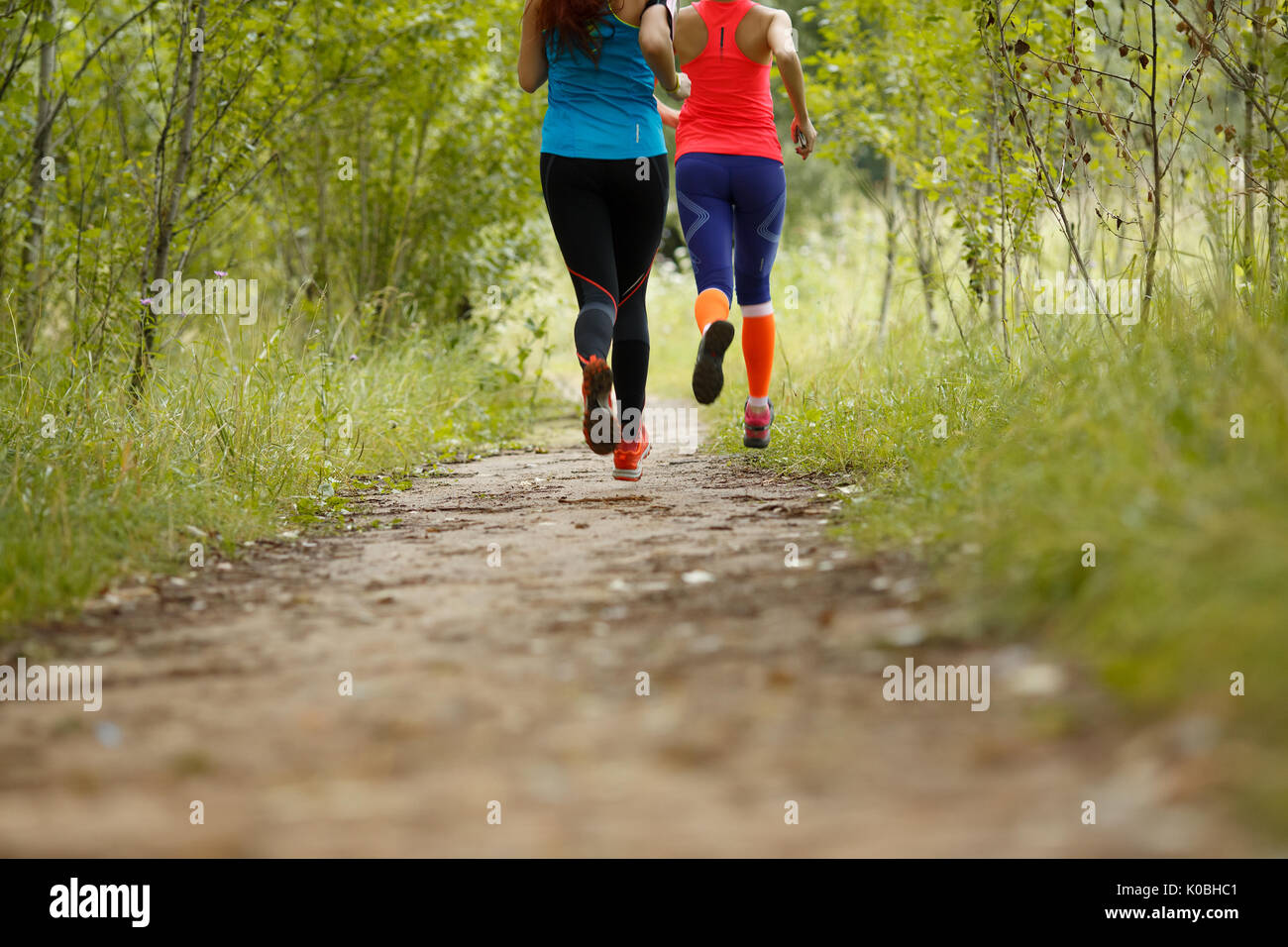 Two girls running in woods hi-res stock photography and images - Alamy